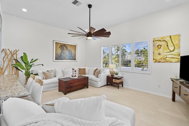 living area with ceiling fan, baseboards, visible vents, and recessed lighting