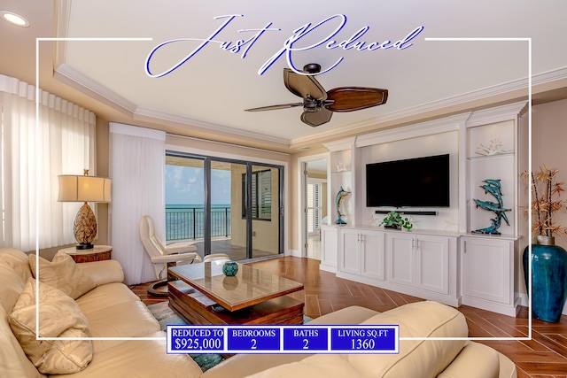 living room featuring a raised ceiling, ornamental molding, and ceiling fan
