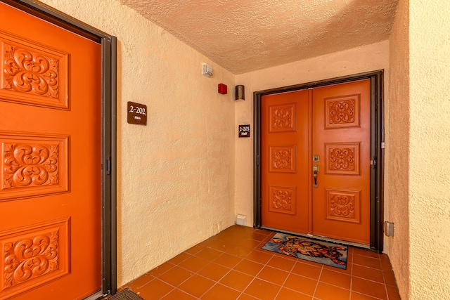 property entrance featuring stucco siding