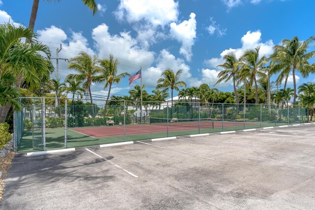 view of sport court featuring fence