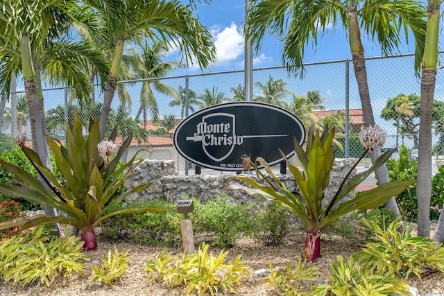 community sign featuring fence