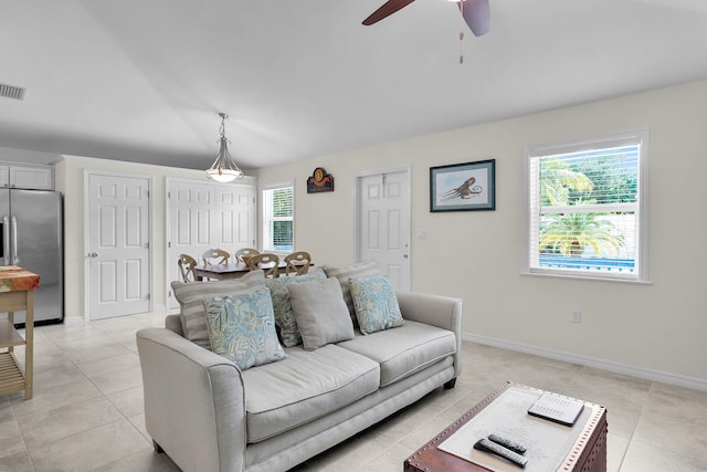 894 La Paloma Rd, Key Largo, FL 33037 - living area with a ceiling fan and light tile patterned floors