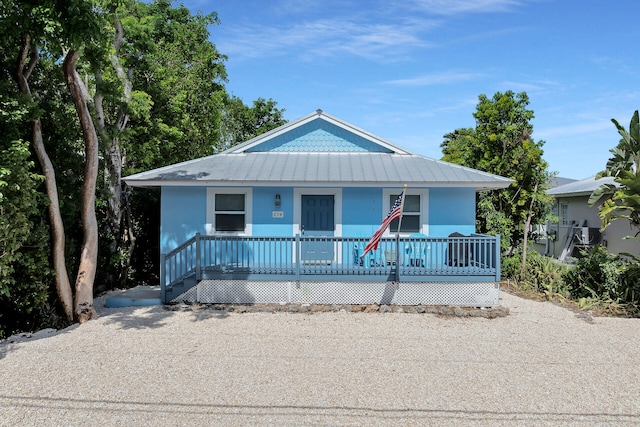 894 La Paloma Rd, Key Largo, FL 33037 - view of front of property featuring a porch and a metal roof