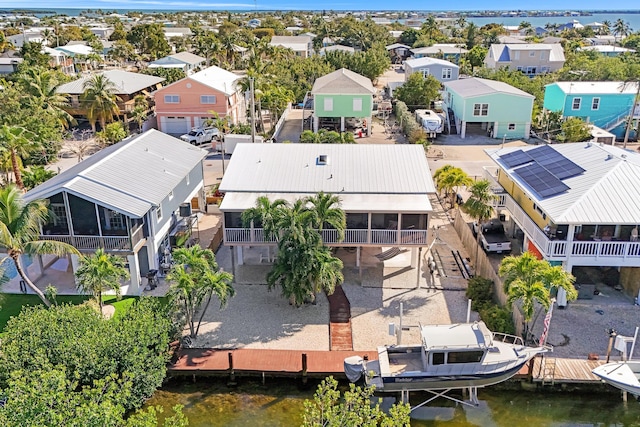 aerial view featuring a water view and a residential view