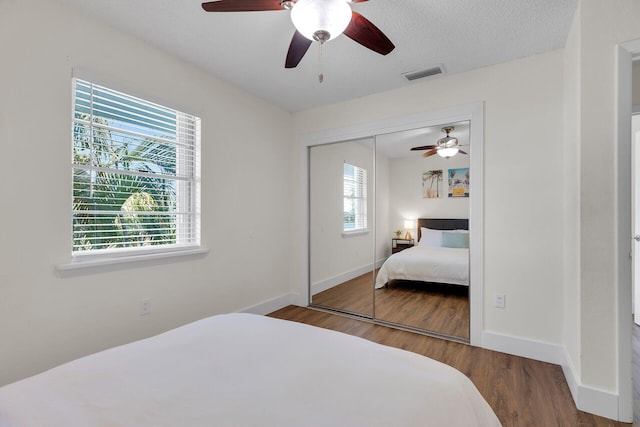 878 La Paloma Rd, Key Largo, FL 33037 - bedroom featuring wood finished floors, a closet, baseboards, and ceiling fan