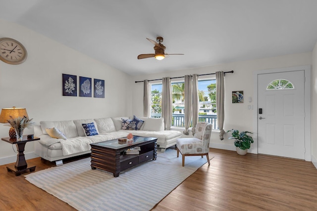 878 La Paloma Rd, Key Largo, FL 33037 - living room with a ceiling fan, wood finished floors, baseboards, and lofted ceiling
