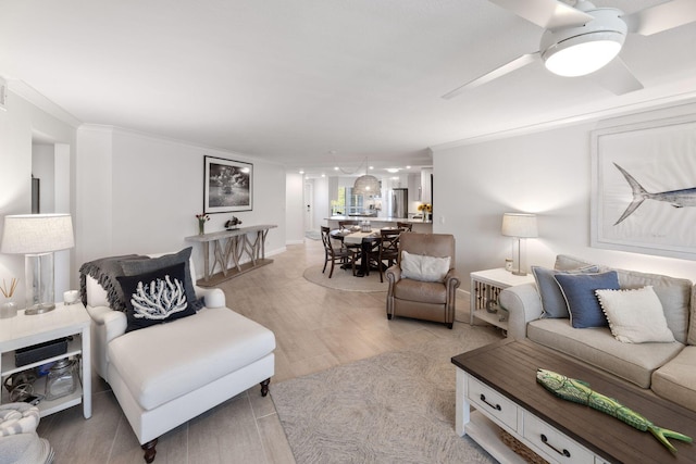 living room featuring crown molding and light hardwood / wood-style flooring