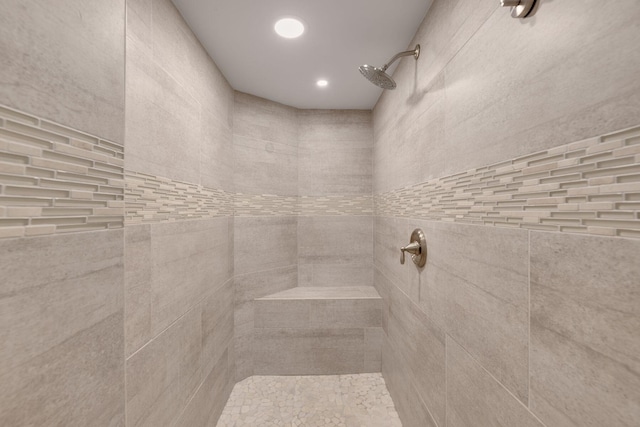 bathroom with tiled shower