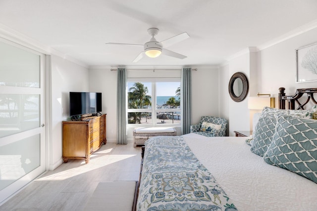 bedroom with ornamental molding and ceiling fan