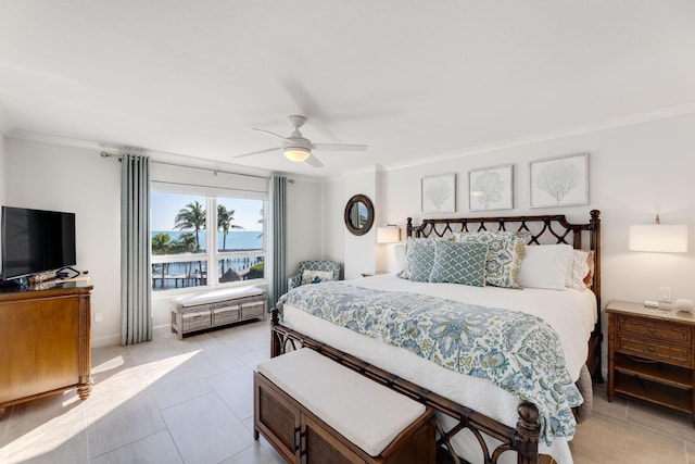 bedroom featuring light tile patterned floors, ornamental molding, and ceiling fan