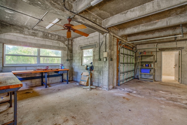 28573 Le Grand Rd, Little Torch, FL 33042 - garage featuring a workshop area, concrete block wall, and a ceiling fan