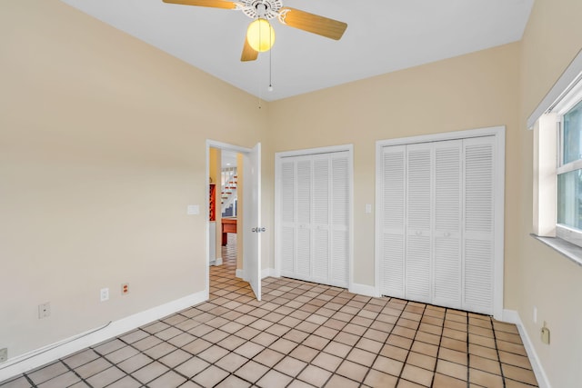 28573 Le Grand Rd, Little Torch, FL 33042 - unfurnished bedroom featuring multiple closets and ceiling fan