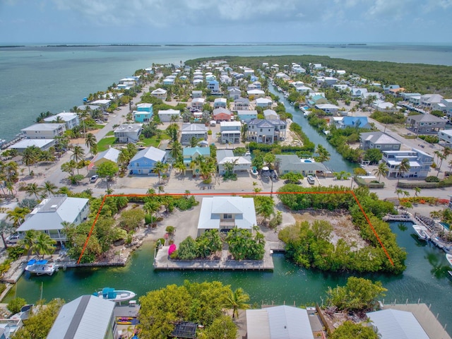 28573 Le Grand Rd, Little Torch, FL 33042 - aerial perspective of suburban area featuring a large body of water and property parcel outlined