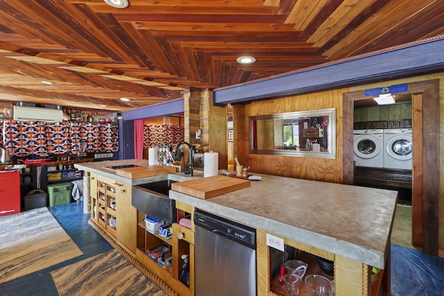 kitchen featuring sink, dishwasher, washer and dryer, wooden ceiling, and wood walls