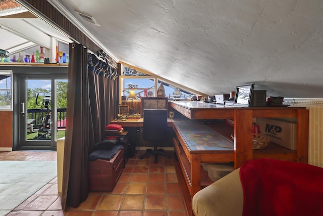 home office featuring vaulted ceiling and a textured ceiling