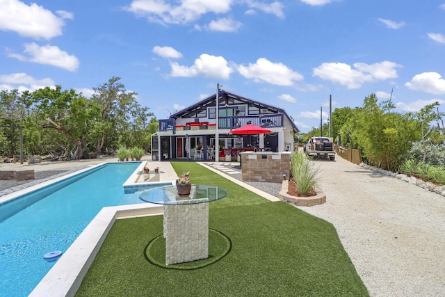 view of pool with a yard and a patio area