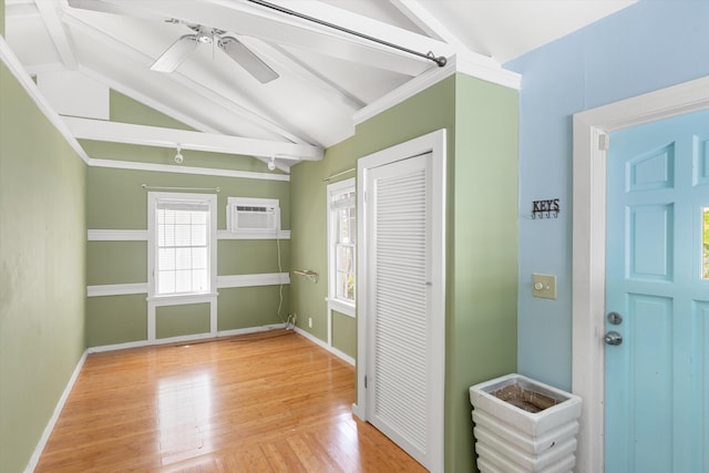 1500 Seminary St Unit 5A, Key West, FL 33040 - unfurnished bedroom featuring a wall unit AC, a closet, wood finished floors, a ceiling fan, and baseboards
