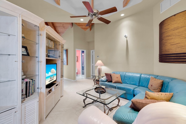 living room featuring wood ceiling, ceiling fan, and high vaulted ceiling