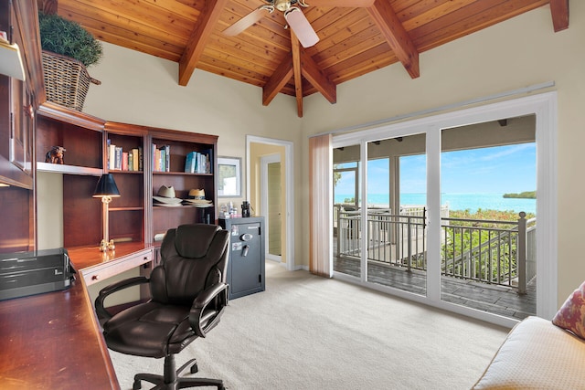 carpeted office with a water view, ceiling fan, wooden ceiling, and vaulted ceiling with beams