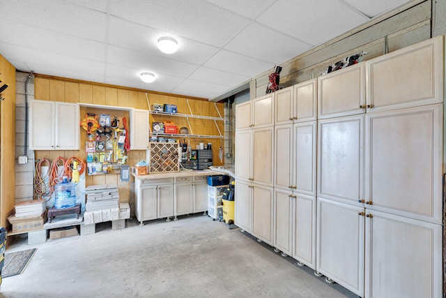 garage featuring wooden walls