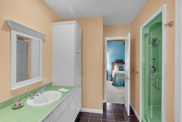 bathroom featuring tile patterned flooring, vanity, and an enclosed shower