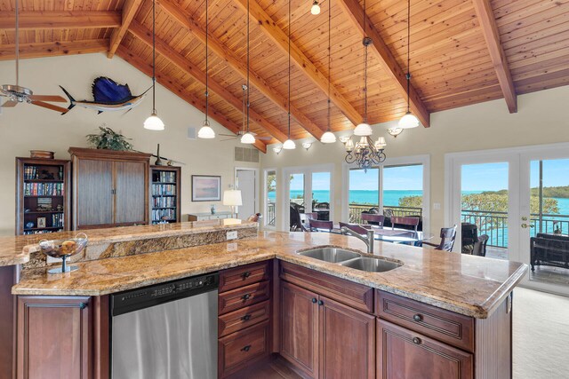 kitchen with pendant lighting, sink, stainless steel dishwasher, a water view, and french doors