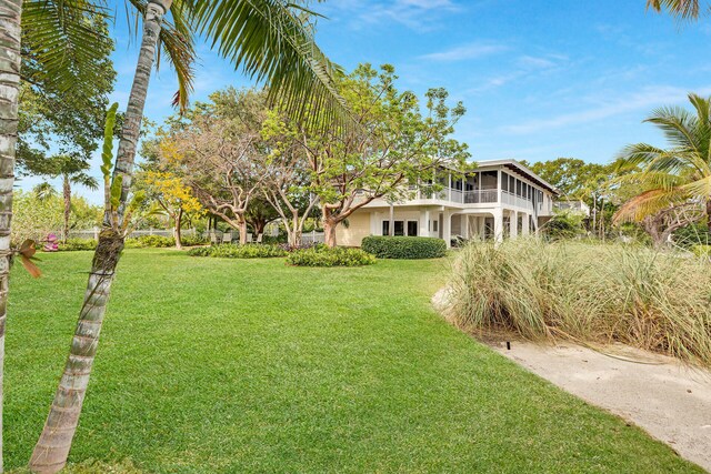 view of yard with a sunroom