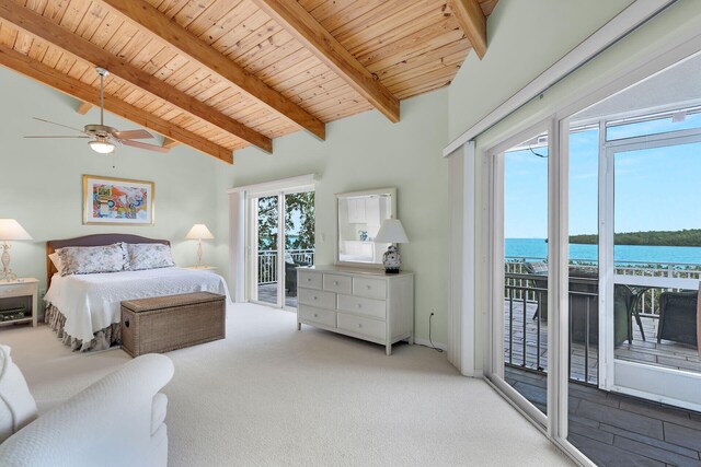 carpeted bedroom with a water view, access to exterior, beam ceiling, and wood ceiling