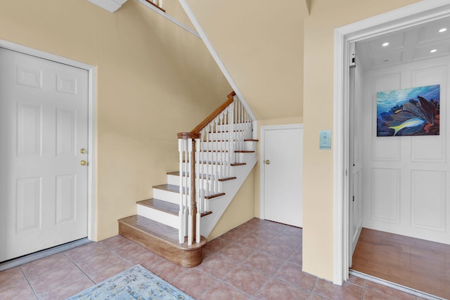 stairs with tile patterned flooring