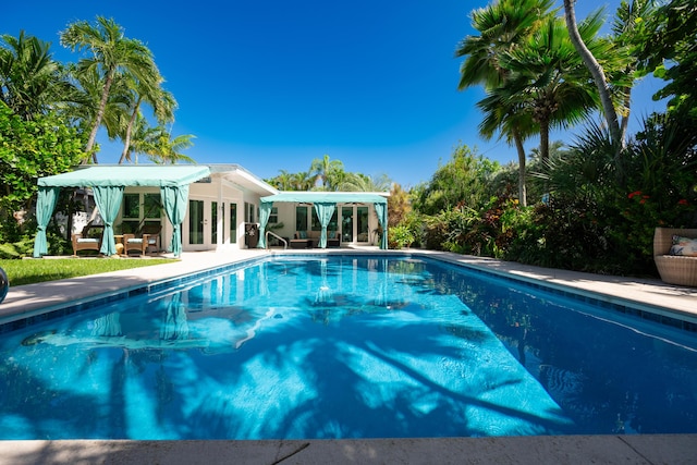 view of swimming pool featuring a gazebo and a patio area