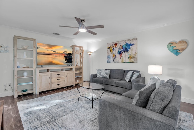 living room featuring crown molding and ceiling fan