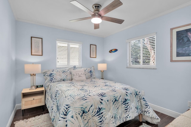 bedroom with crown molding, ceiling fan, and dark hardwood / wood-style flooring