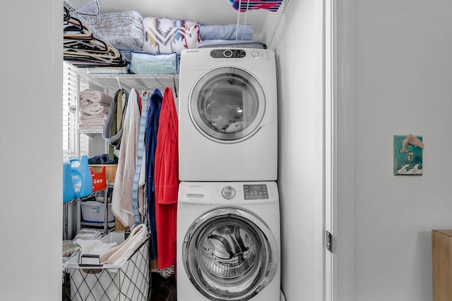 laundry room featuring stacked washing maching and dryer