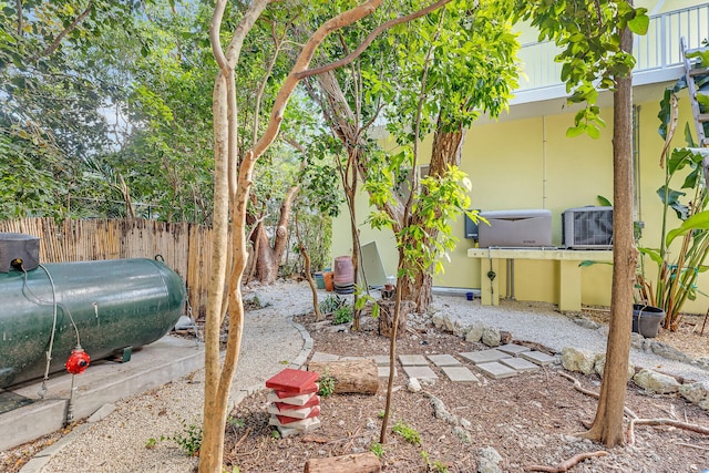 view of yard with central AC unit