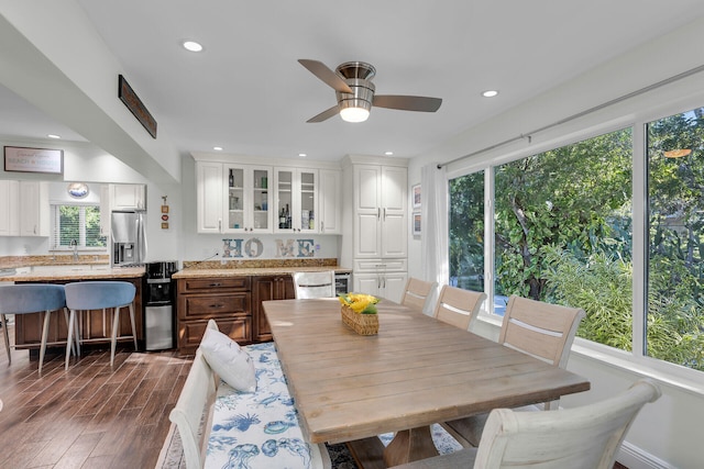 dining area featuring dark hardwood / wood-style floors and ceiling fan