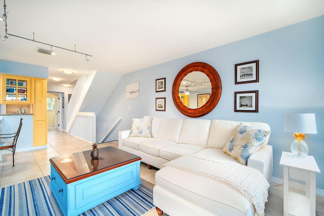 95 Coco Plum Dr Unit 4C, Marathon, FL 33050 - living room with rail lighting, light tile patterned floors, visible vents, and baseboards