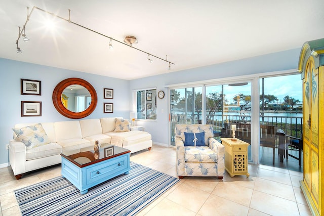 95 Coco Plum Dr Unit 4C, Marathon, FL 33050 - living area with light tile patterned floors, baseboards, and track lighting