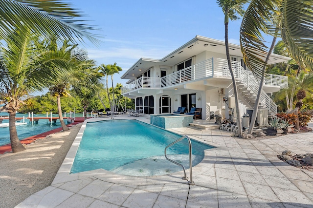 view of swimming pool featuring a patio area