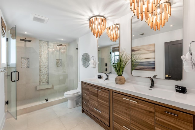 bathroom with a chandelier, vanity, walk in shower, toilet, and tile patterned floors