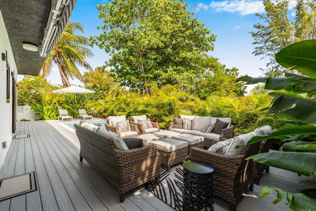 wooden terrace with an outdoor hangout area