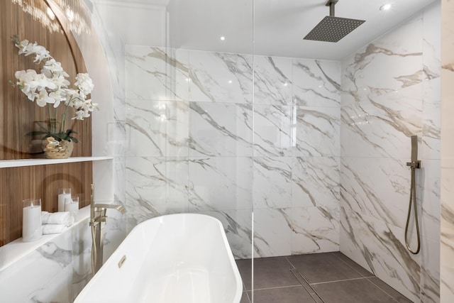 bathroom with tile patterned flooring and separate shower and tub