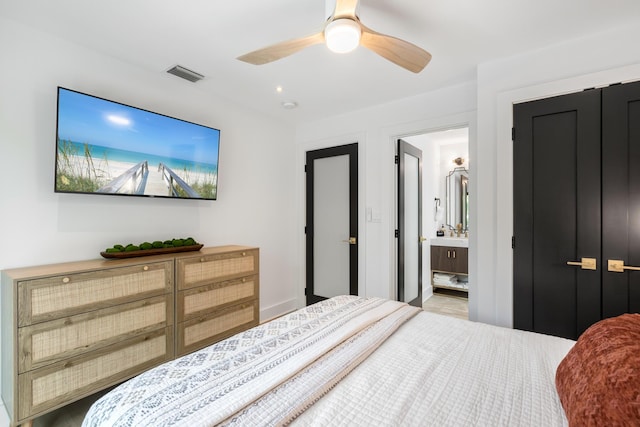 bedroom with ensuite bathroom and ceiling fan