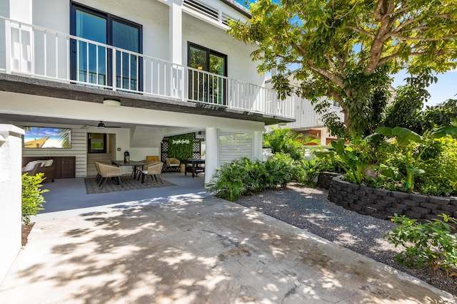 exterior space with a balcony and a patio