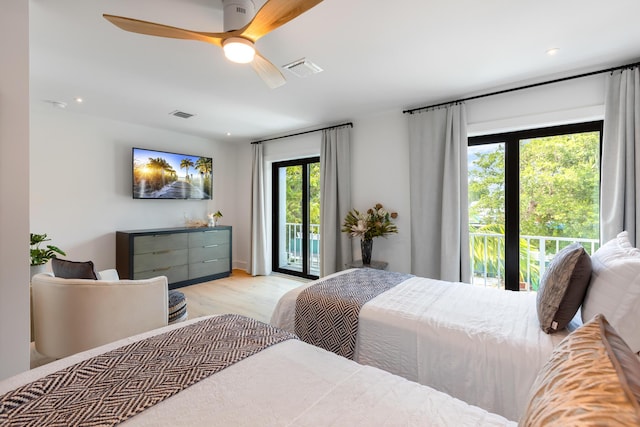 bedroom with access to exterior, ceiling fan, and light hardwood / wood-style flooring