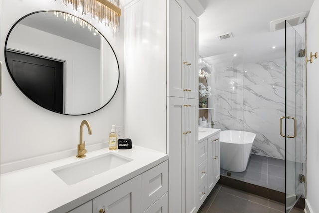 bathroom featuring vanity, separate shower and tub, and tile patterned flooring