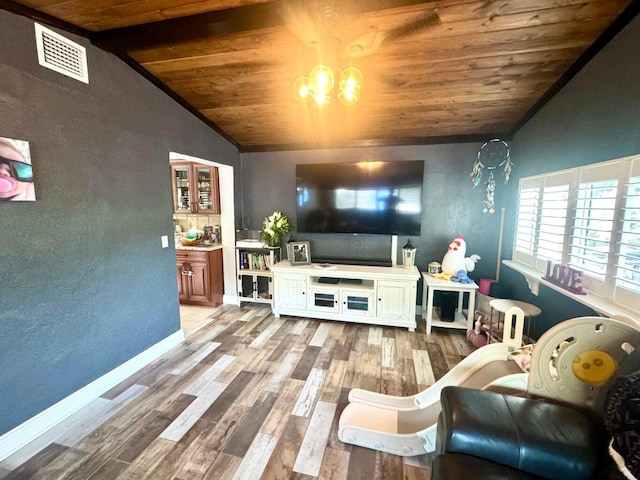 living room with hardwood / wood-style flooring, vaulted ceiling, an inviting chandelier, and wood ceiling