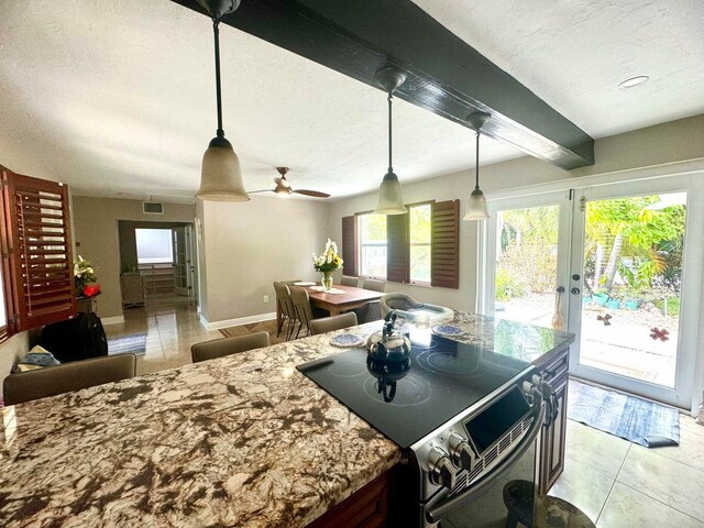 kitchen with french doors, stainless steel electric stove, hanging light fixtures, and a textured ceiling