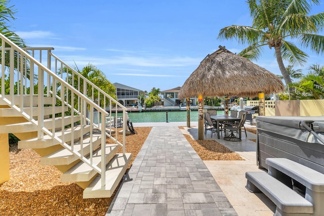 view of patio / terrace with stairs and a boat dock