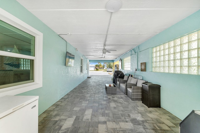 view of patio / terrace with outdoor lounge area and a ceiling fan