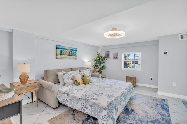 bedroom with visible vents, baseboards, and light tile patterned flooring